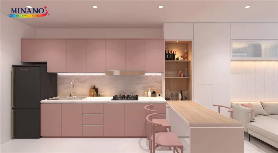 Sơn chung cư phòng bếp tone màu hồng pastel ngọt ngào và sáng sủa. Tường và kệ tủ bếp được sơn màu hồng nhạt, tạo nền cho không gian nữ tính và dịu dàng